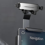 Sleek black and silver metal car phone holder mounted on a dashboard for navigation.