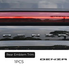 Chrome silver Denza rear emblem trim for premium car exterior styling.