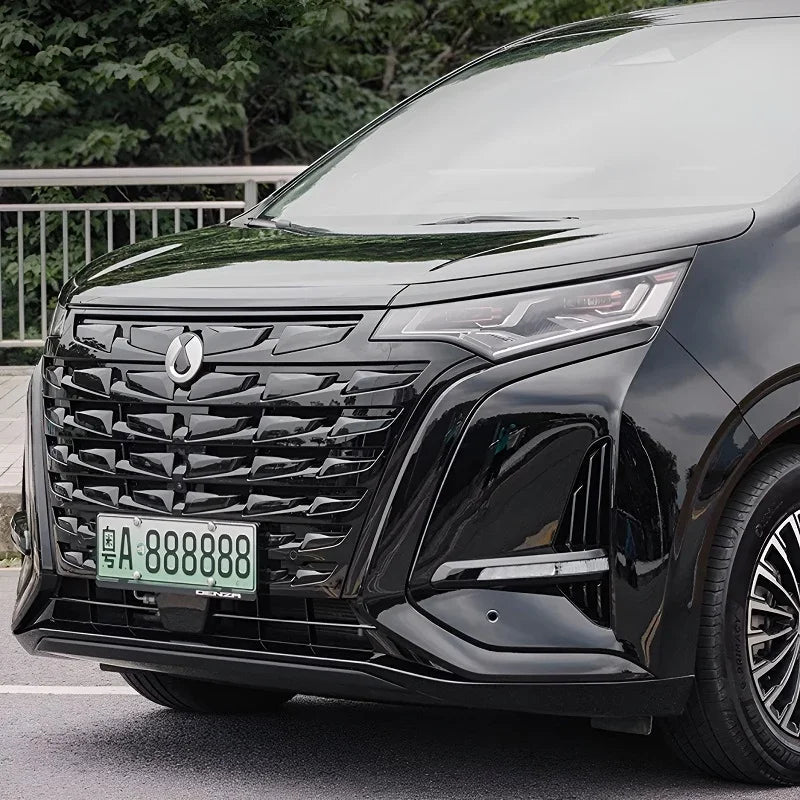 Glossy black front grille and sleek LED headlights of a premium BYD Denza vehicle.