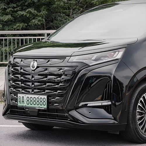 Glossy black front grille and sleek LED headlights of a premium BYD Denza vehicle.