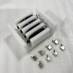 Set of four black car door handles with metal clips in protective white foam packaging.