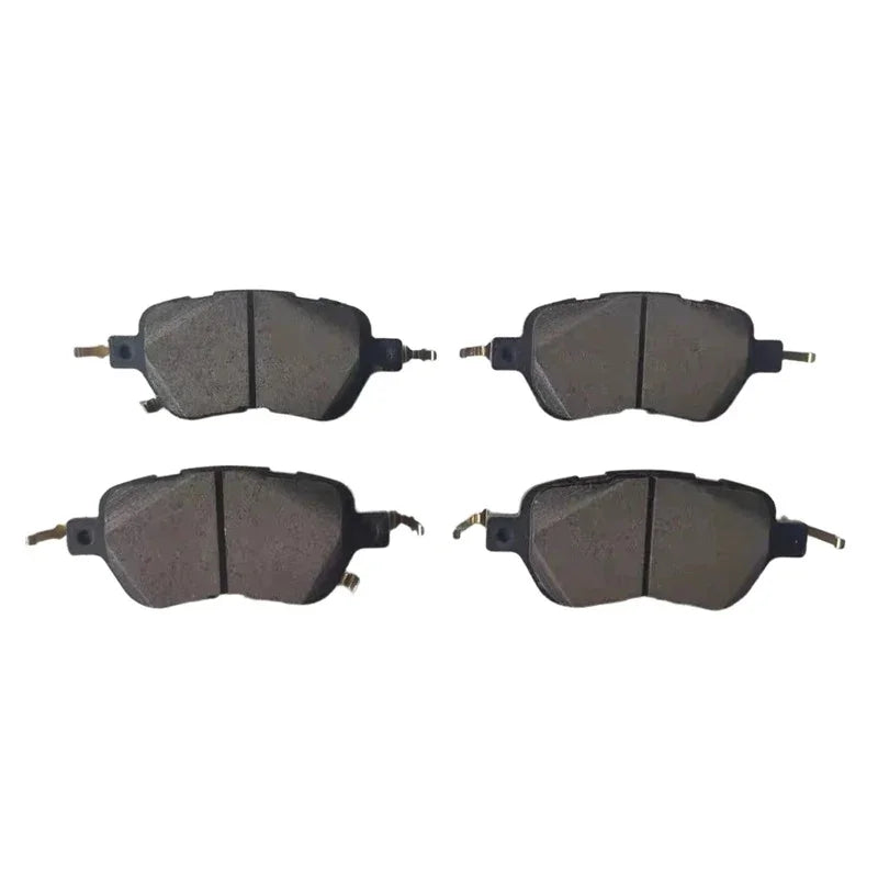Set of four premium black ceramic brake pads for high-performance automotive braking.