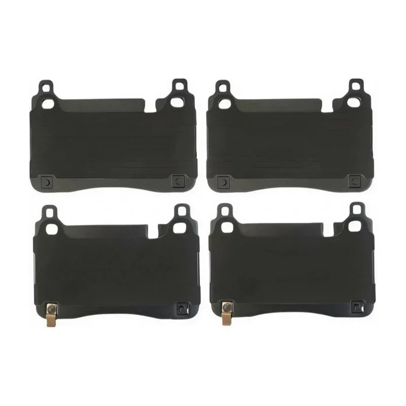 Set of four durable black rubber floor mats for car protection.