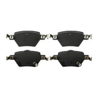 Set of four premium black ceramic brake pads for high-performance automotive braking.