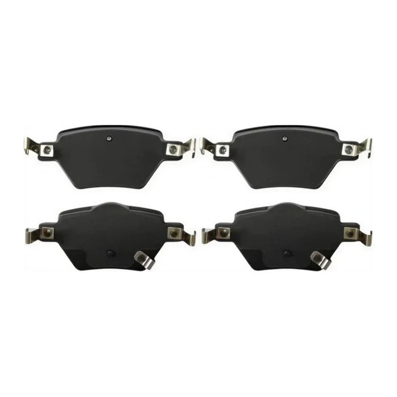 Set of four premium black ceramic brake pads for high-performance automotive braking.