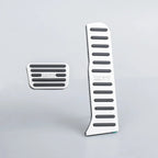 Silver aluminum alloy car pedals with black anti-slip rubber strips for BYD vehicles.