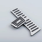Silver aluminum alloy car pedals with black anti-slip rubber strips for BYD vehicles.