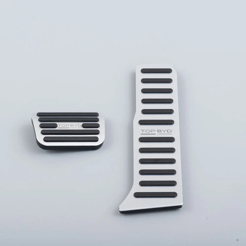 Silver aluminum pedal covers with black non-slip rubber grips for BYD accessories.