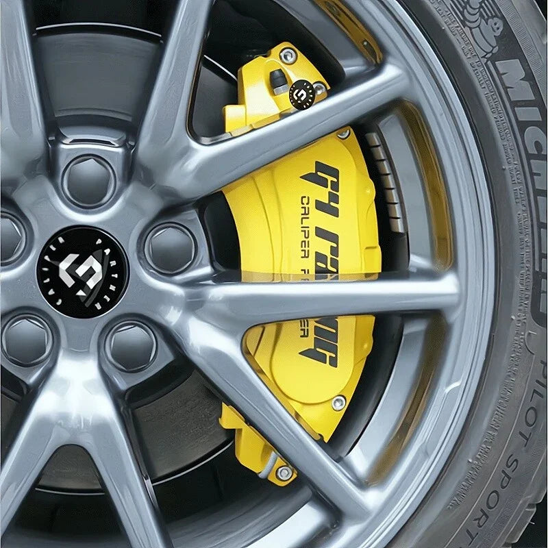High-performance bright yellow brake caliper installed on a sleek grey alloy wheel.