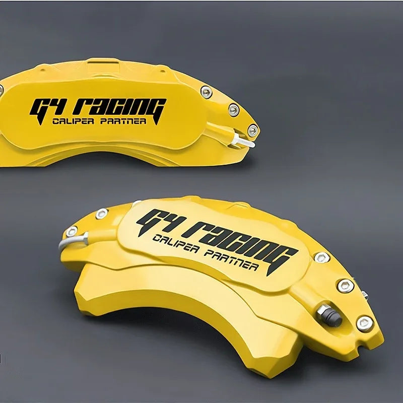 Two professional yellow metal G4 Racing brake caliper covers with black branding