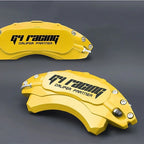 Two professional yellow metal G4 Racing brake caliper covers with black branding