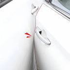Close-up of white car door handles with a red decorative accent stripe.