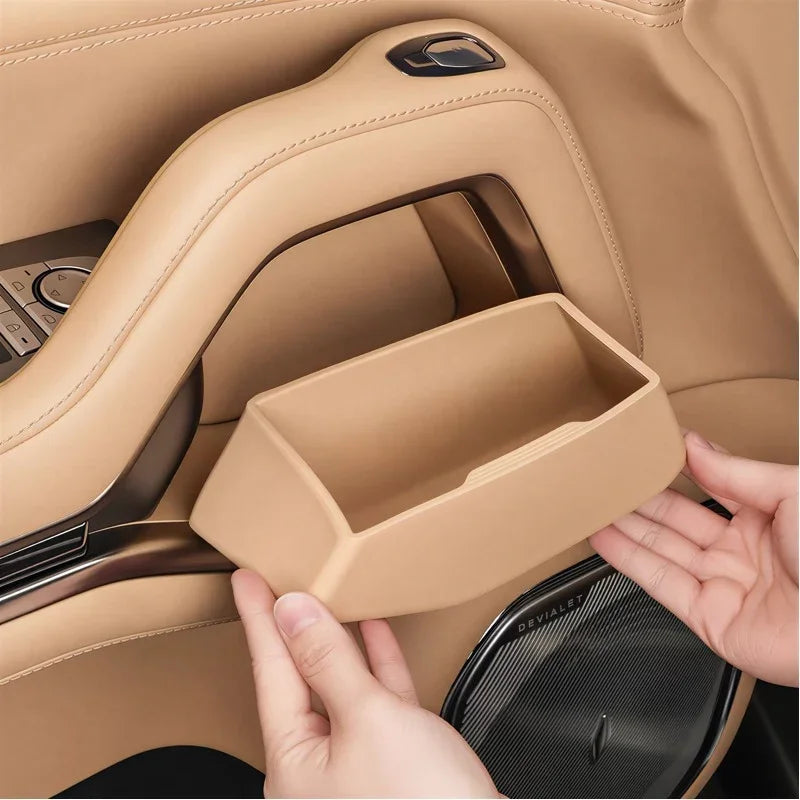 Tan leather-textured center console storage tray for BYD car interior.