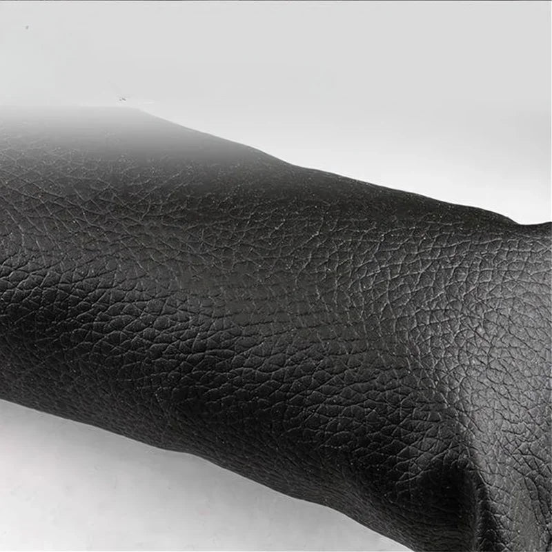 Premium black textured leather material for high-quality car interior upholstery.