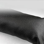 Premium black textured leather material for high-quality car interior upholstery.