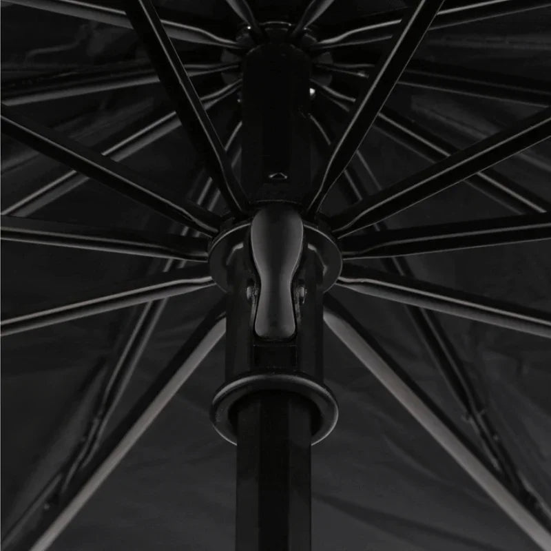 Close-up of a durable black metal umbrella frame and reinforced central shaft structure.