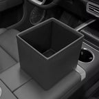 Black leather car trash bin organizer installed in a vehicle center console