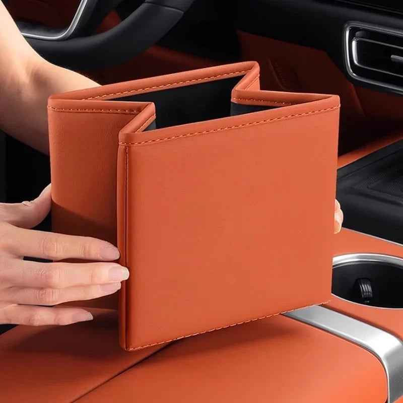 Professional brown leather car document holder with precision stitching in a vehicle interior