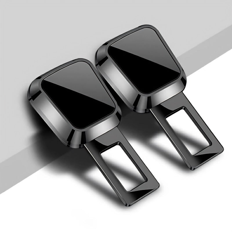 Pair of glossy black metallic car door lock knob covers with a sleek rectangular design.