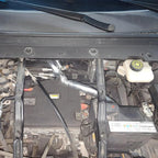 Protective silver thermal insulation wrap covering engine components for heat resistance.