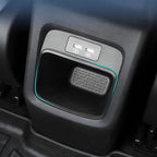 Black interior car storage compartment featuring dual USB charging ports and blue LED accent lighting.