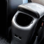 Silver metallic center console storage bin with a black interior for BYD cars.