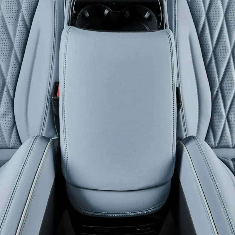 Light blue premium leather center console armrest with precise stitching for BYD interior.