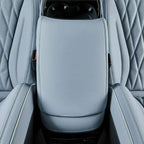 Light blue premium leather center console armrest with precise stitching for BYD interior.