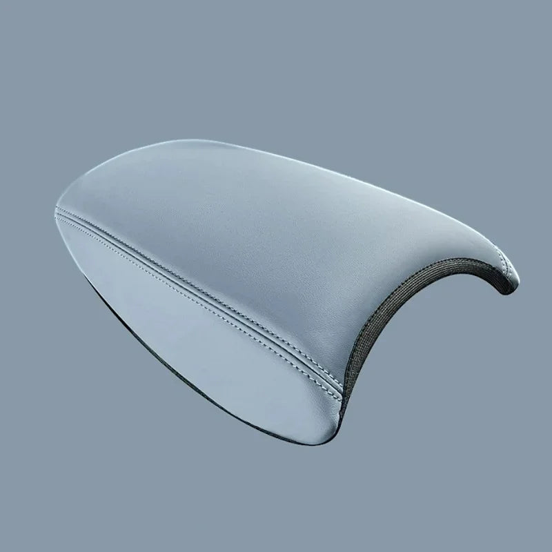 Light blue leather center armrest console cover with precision stitching