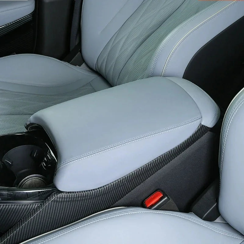 Light grey premium leather center console armrest with carbon fiber texture trim for BYD.