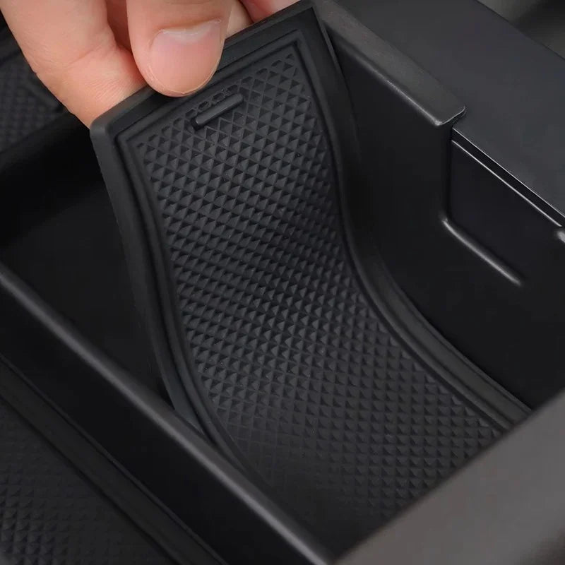 Black textured anti-slip silicone tray liner for car center console storage.