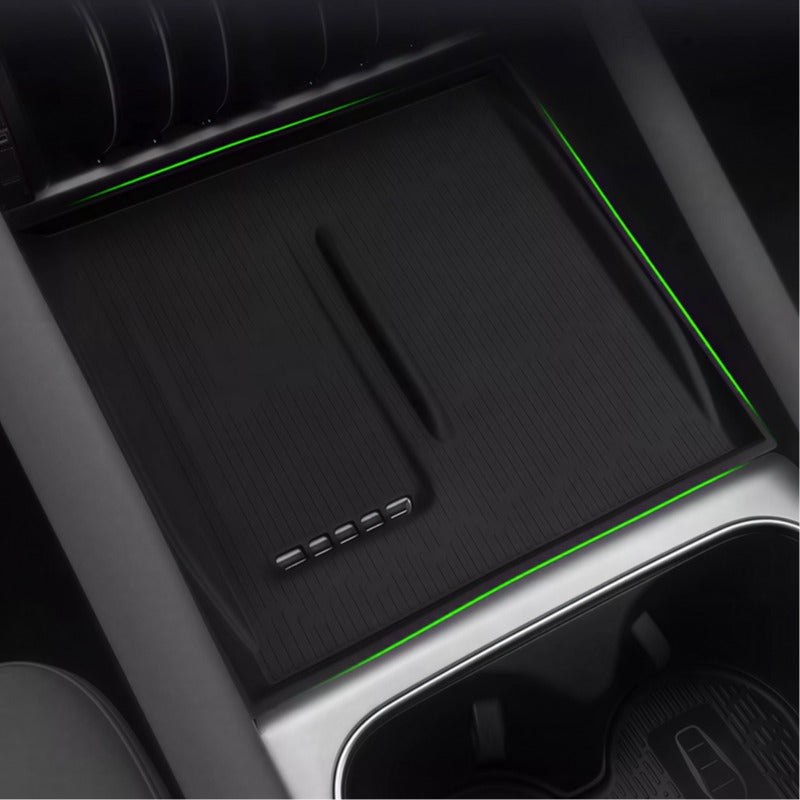 Black textured premium center console organizer tray with integrated green ambient LED lighting.