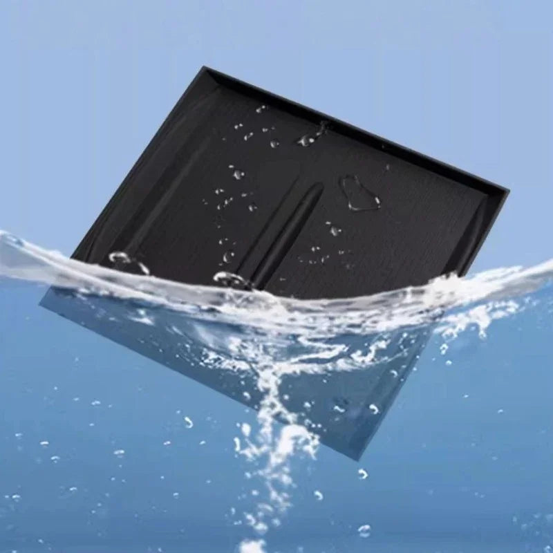 Waterproof black textured car floor mat partially submerged in clear blue water.