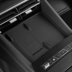 Black interior center console with a wireless charging pad marked MAX 50W.