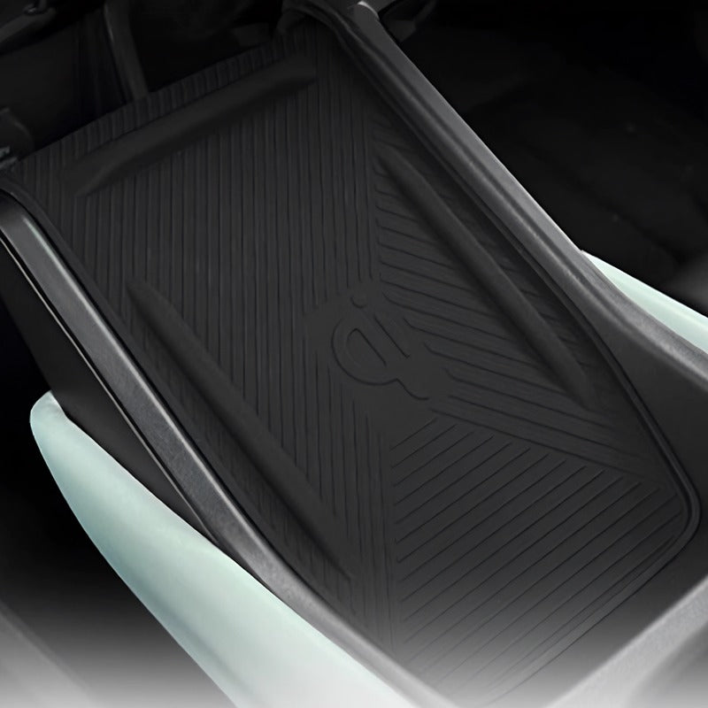 Black textured TPE all-weather car floor mat with anti-slip ridges and branded logo.