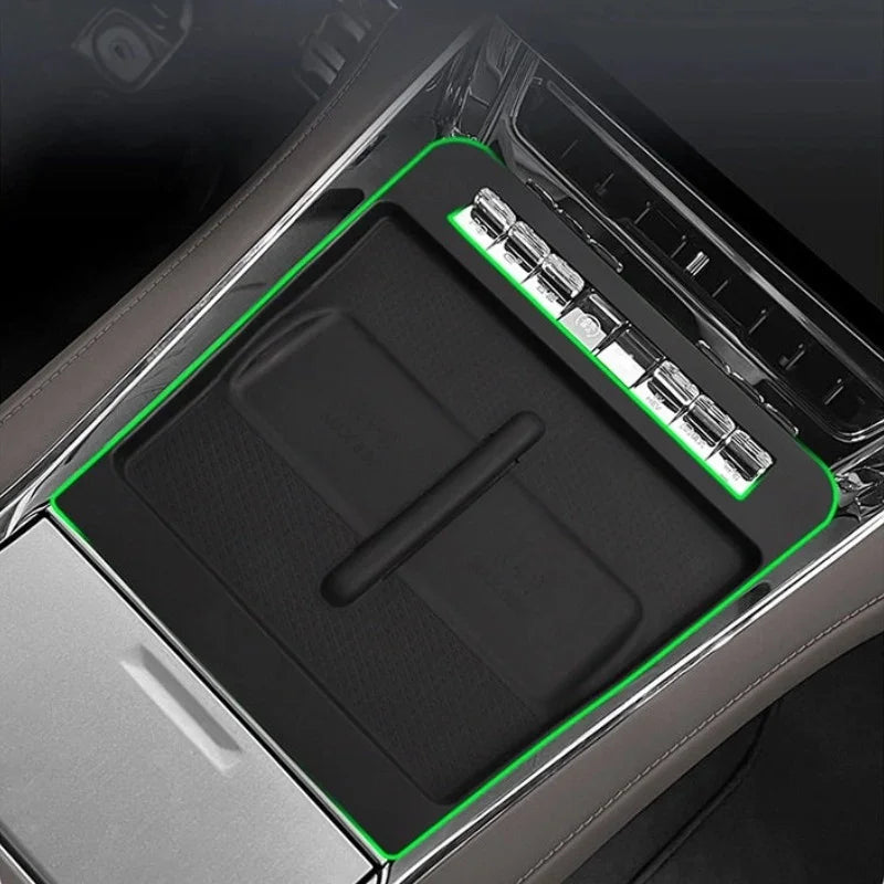 Black rubberized center console tray protector for BYD vehicles, providing a custom fit.