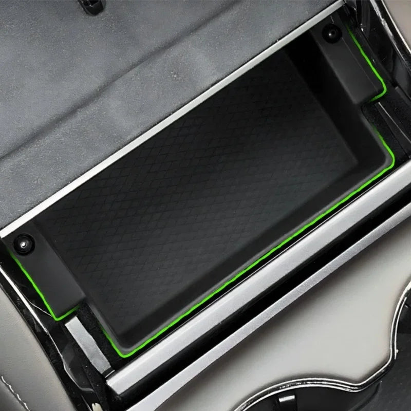 Black textured TPE center console tray with vibrant green edge trim for BYD car interior.