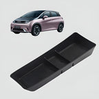 Black textured non-slip center console organizer tray for BYD electric car interior.