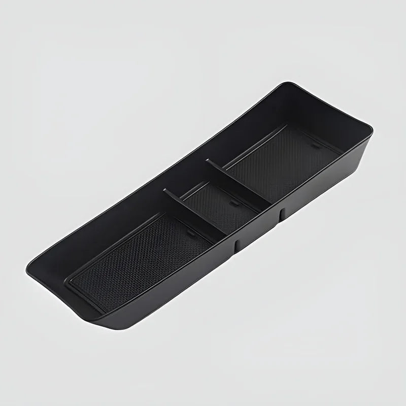Black durable matte organizer tray with textured anti-slip compartments for car storage.
