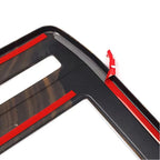 Black textured protective trim strip with red adhesive backing for car interior surfaces.