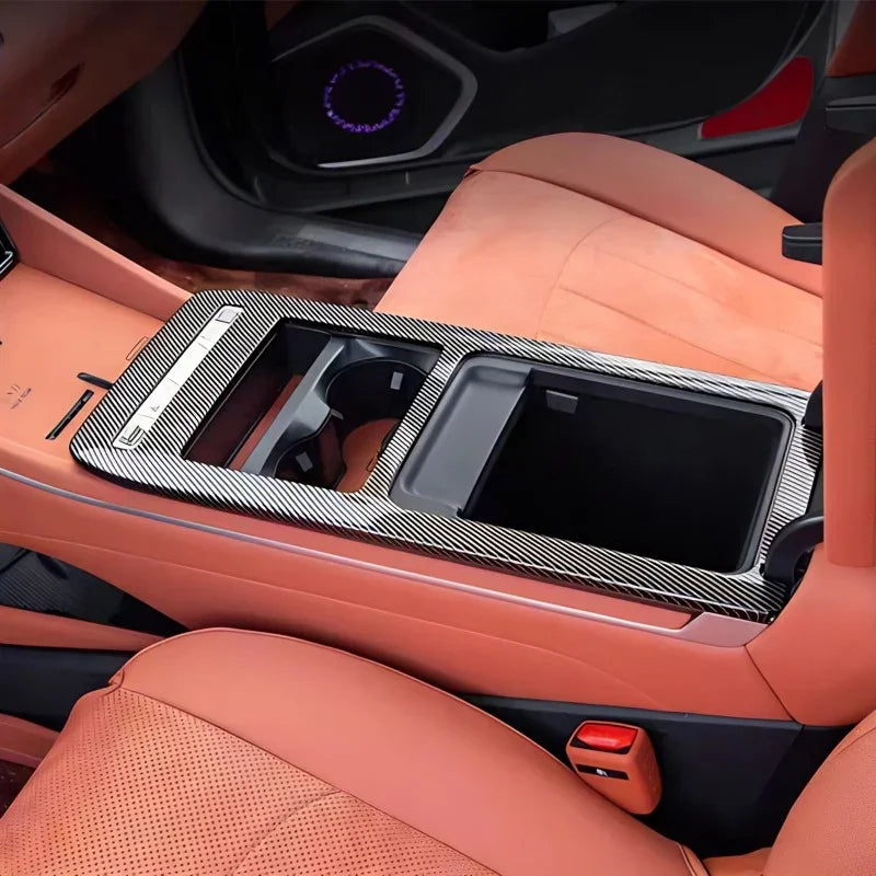 Carbon fiber texture center console organizer tray in black for BYD interior enhancement.