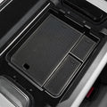 Black textured TPE trunk organizer tray for custom-fit car cargo protection.