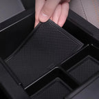 Black textured non-slip silicone organizer tray for car center console storage.
