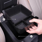 Black matte plastic multi-compartment car center console organizer tray for BYD accessories.