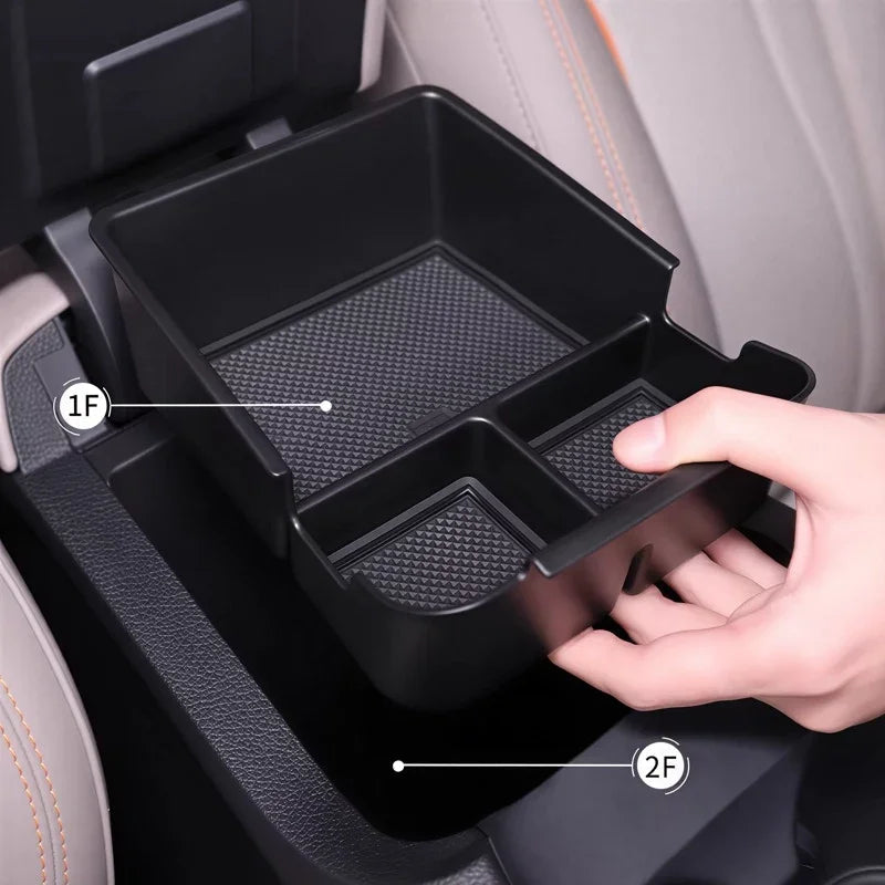 Black matte plastic multi-compartment car center console organizer tray for BYD accessories.