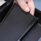 Black textured anti-slip rubber organizer tray for BYD car interior storage.