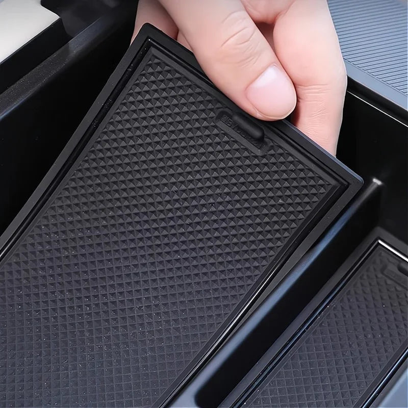 Black textured anti-slip rubber organizer tray for BYD car interior storage.