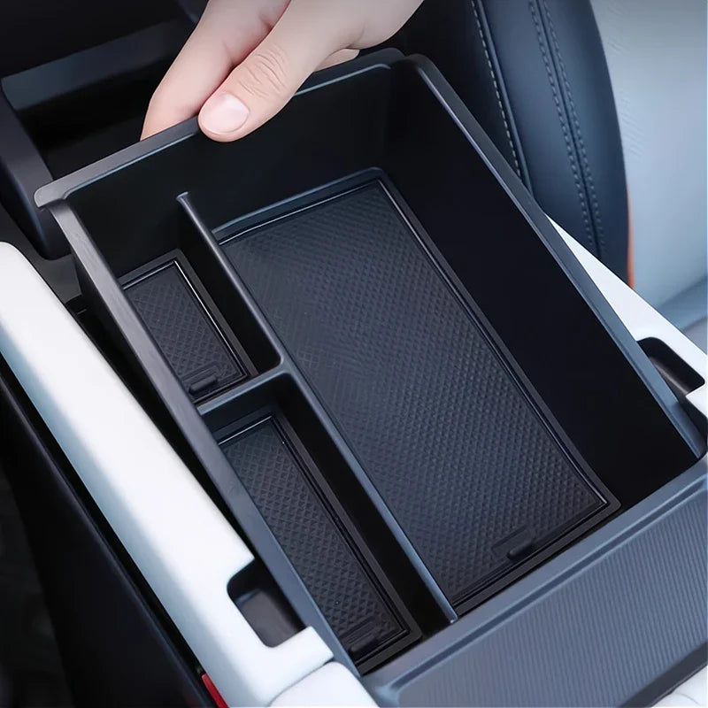 Black multi-compartment EVA organizer tray for car center console storage.