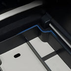 Close-up of a professional black custom-fit car floor mat with durable synthetic material.