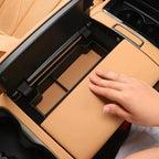 Tan leather center console organizer with compartments for BYD interior.